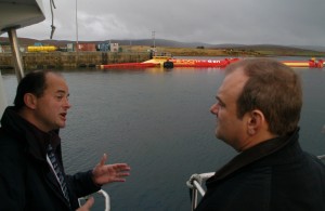Max Carcas speaks with Edward Davey at Lyness (Image: The Orcadian)