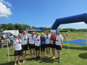 At the finish line, from l-r: Chris Casely, Keith Dampney, Max Carcas, Graeme Busfield, Jenny Norrish, Neil Brown, Morna Brown, and Donald Sinclair.