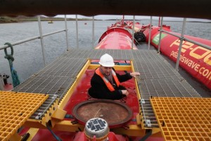 Delegates touring the Pelamis P2 device at Lyness marine renewables port (Credit: Orkney Photographic)