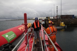 Delegates touring the Pelamis P2 device at Lyness marine renewables port (Credit: Orkney Photographic)