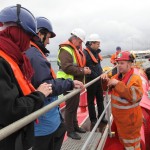 Delegates touring the Pelamis P2 device at Lyness marine renewables port (Credit: Orkney Photographic)
