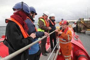 Delegates touring the Pelamis P2 device at Lyness marine renewables port (Credit: Orkney Photographic)