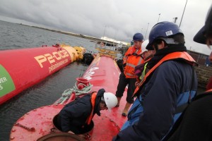 Delegates touring the Pelamis P2 device at Lyness marine renewables port (Credit: Orkney Photographic)