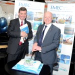 Neil Kermode cutting EMEC's birthday cake with Alex Paterson, HIE