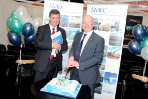 Neil Kermode cutting EMEC's birthday cake with Alex Paterson, HIE