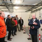 Rémi and Sian enjoying a tour from Neil Kermode of the EMEC substation at Billia Croo as part of the Orkney Ocean Energy Day, June 2014 (Credit Orkney Photographic)