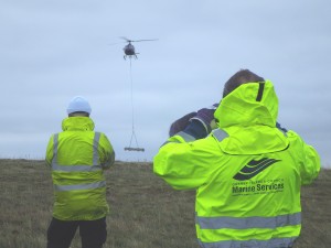 Radar antenna being transporter by helicopter to the Black Craig (Credit EMEC)