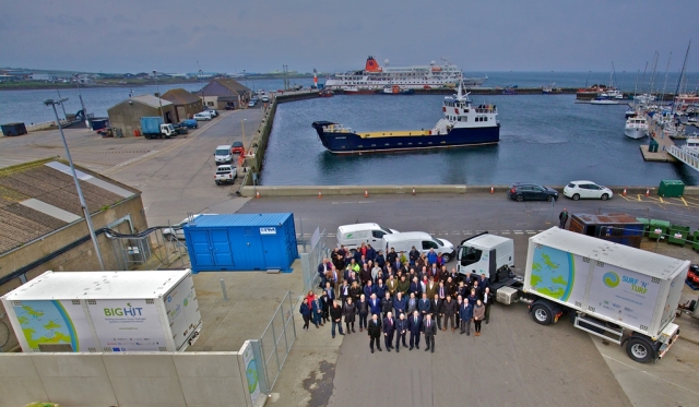 Paul Wheelhouse, Surf n Turf project partners and suppliers with hydrogen fuel cell, mobile storage units and local ferry, Kirkwall Pier (Credit Colin Keldie)