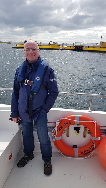 Neil Kermode at EMEC tidal test site, Orbital and Magallanes tidal turbines in background